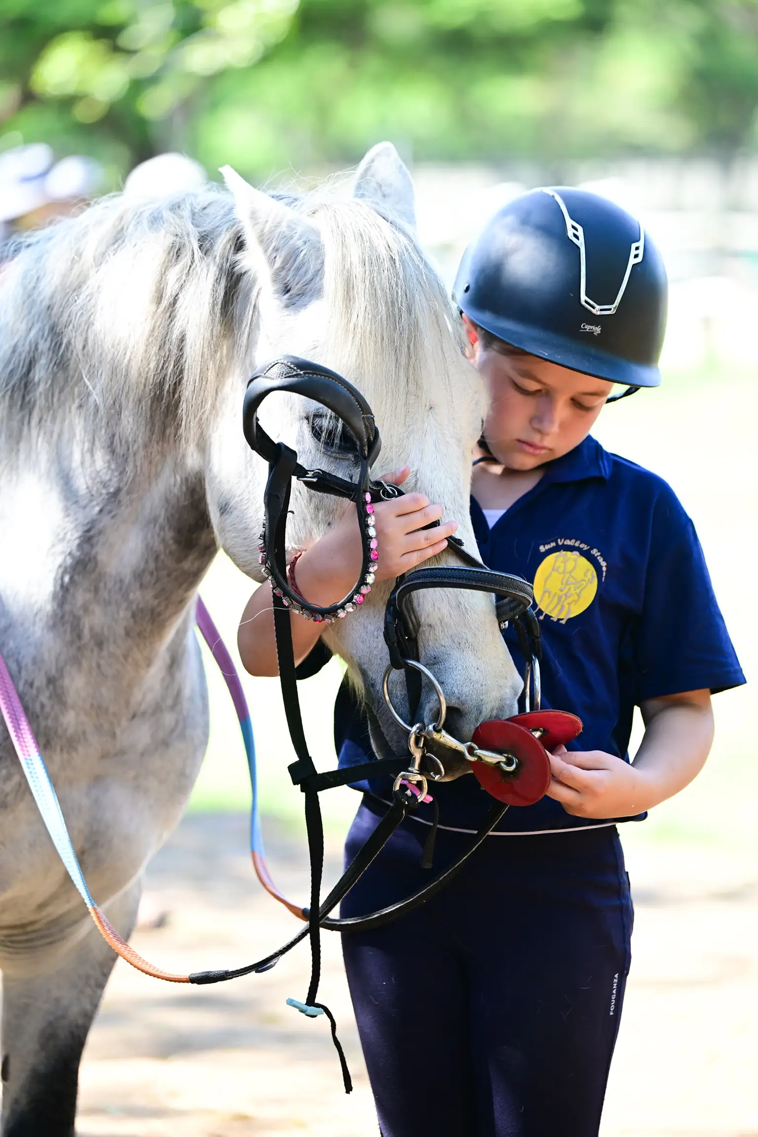 Young rider bonding with a leased horse at Sun Valley Stables, Kyalami